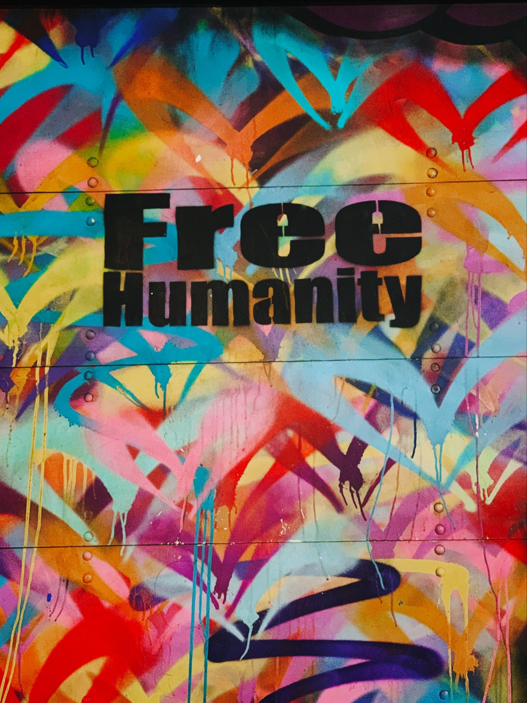 Graffiti image of the words 'Free Humanity'